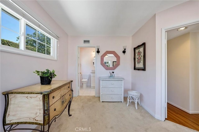 1113 Hollydale Dr, Fullerton, CA 92831 - bedroom with light colored carpet, baseboards, and ensuite bath