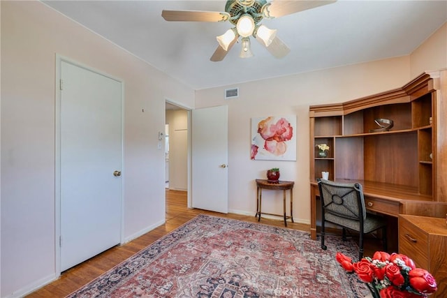 1113 Hollydale Dr, Fullerton, CA 92831 - home office featuring a ceiling fan, wood finished floors, and baseboards