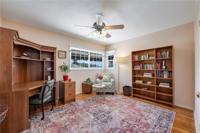 1113 Hollydale Dr, Fullerton, CA 92831 - office space featuring a ceiling fan, wood finished floors, and baseboards