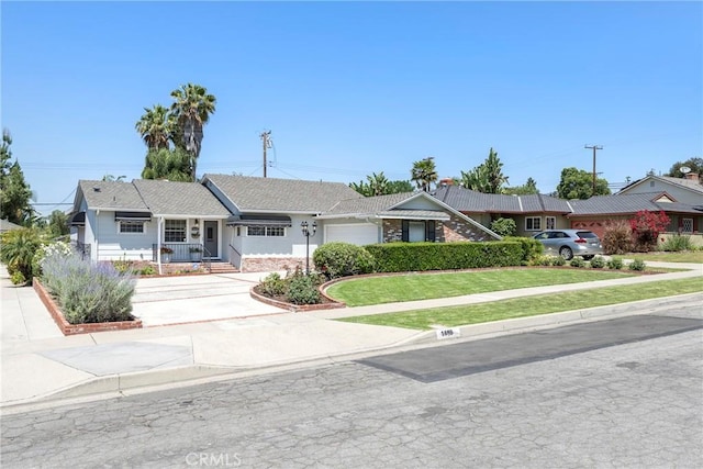 1113 Hollydale Dr, Fullerton, CA 92831 - single story home with concrete driveway, an attached garage, a front lawn, and covered porch
