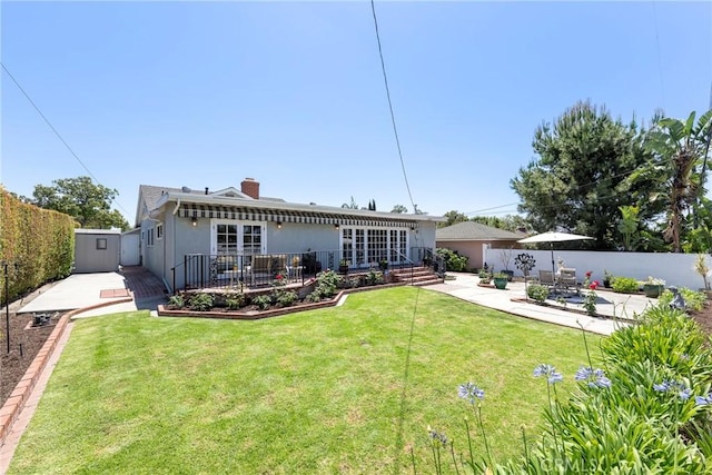 1113 Hollydale Dr, Fullerton, CA 92831 - back of house featuring a patio, a chimney, and stucco siding
