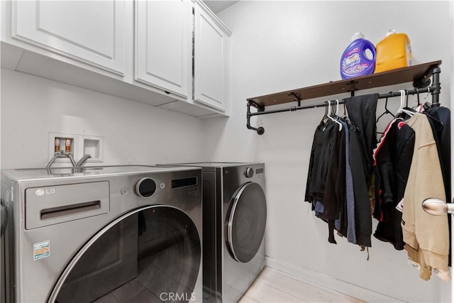 4803 Hawk Ridge Ave, Fontana, CA 92336 - washroom with washer and clothes dryer, cabinet space, baseboards, and light tile patterned floors