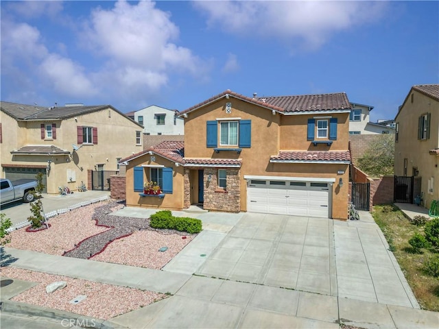 4803 Hawk Ridge Ave, Fontana, CA 92336 - view of front facade featuring a tiled roof, stucco siding, concrete driveway, a garage, and a gate