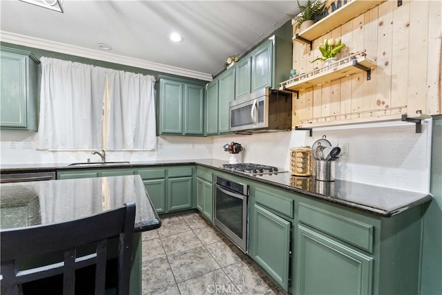 4803 Hawk Ridge Ave, Fontana, CA 92336 - kitchen with stainless steel appliances, green cabinets, a sink, dark stone countertops, and ornamental molding