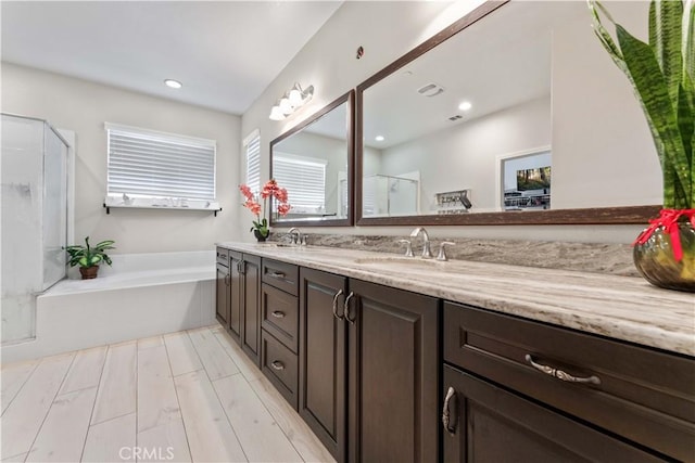 4803 Hawk Ridge Ave, Fontana, CA 92336 - bathroom with a shower stall, double vanity, a bath, and recessed lighting