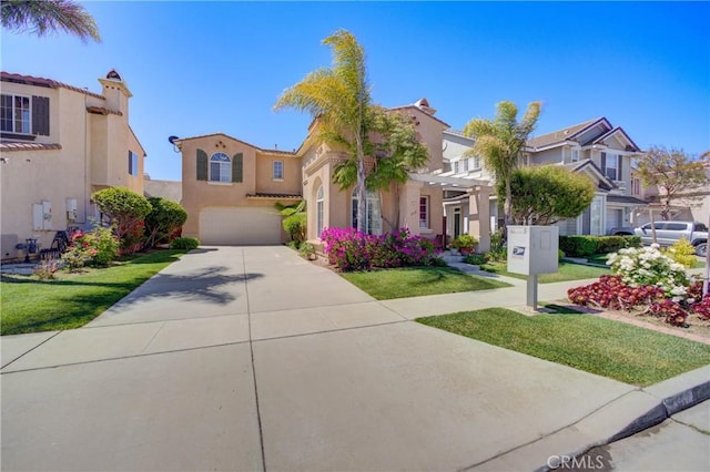 932 Provance Ave, Santa Maria, CA 93458 - mediterranean / spanish home featuring a residential view, an attached garage, stucco siding, concrete driveway, and a pergola