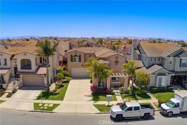 932 Provance Ave, Santa Maria, CA 93458 - view of front facade with a residential view, an attached garage, stucco siding, and driveway
