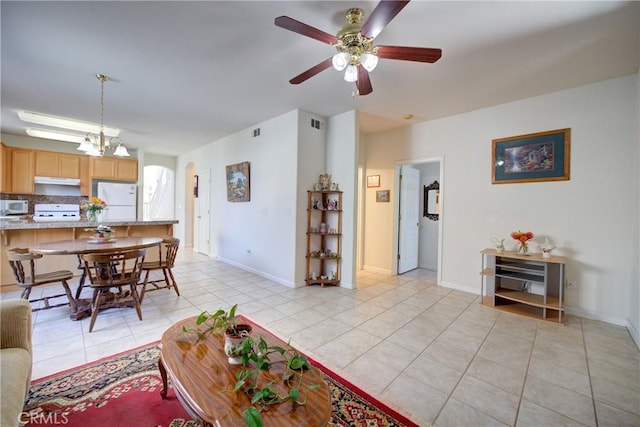 932 Provance Ave, Santa Maria, CA 93458 - living room with arched walkways, ceiling fan, light tile patterned floors, a chandelier, and baseboards