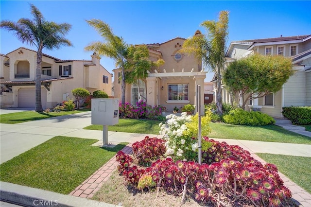 932 Provance Ave, Santa Maria, CA 93458 - mediterranean / spanish house with stucco siding, a pergola, and a front lawn