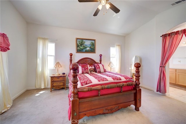 932 Provance Ave, Santa Maria, CA 93458 - bedroom featuring light carpet, multiple windows, lofted ceiling, connected bathroom, and baseboards