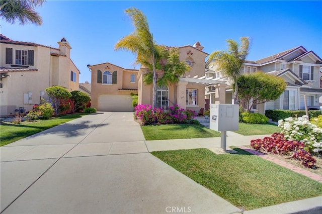 932 Provance Ave, Santa Maria, CA 93458 - mediterranean / spanish-style home featuring an attached garage, stucco siding, driveway, and a residential view