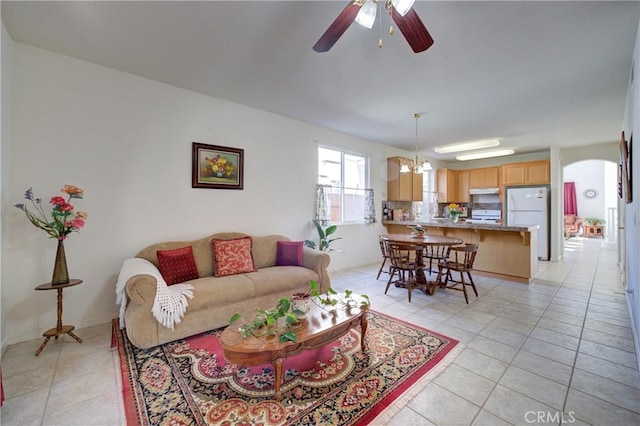 932 Provance Ave, Santa Maria, CA 93458 - living area featuring light tile patterned floors, a ceiling fan, and arched walkways