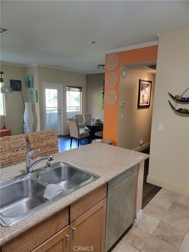 22681 Oakgrove Unit 536, Aliso Viejo, CA 92656 - kitchen featuring stainless steel dishwasher, crown molding, a sink, light countertops, and baseboards