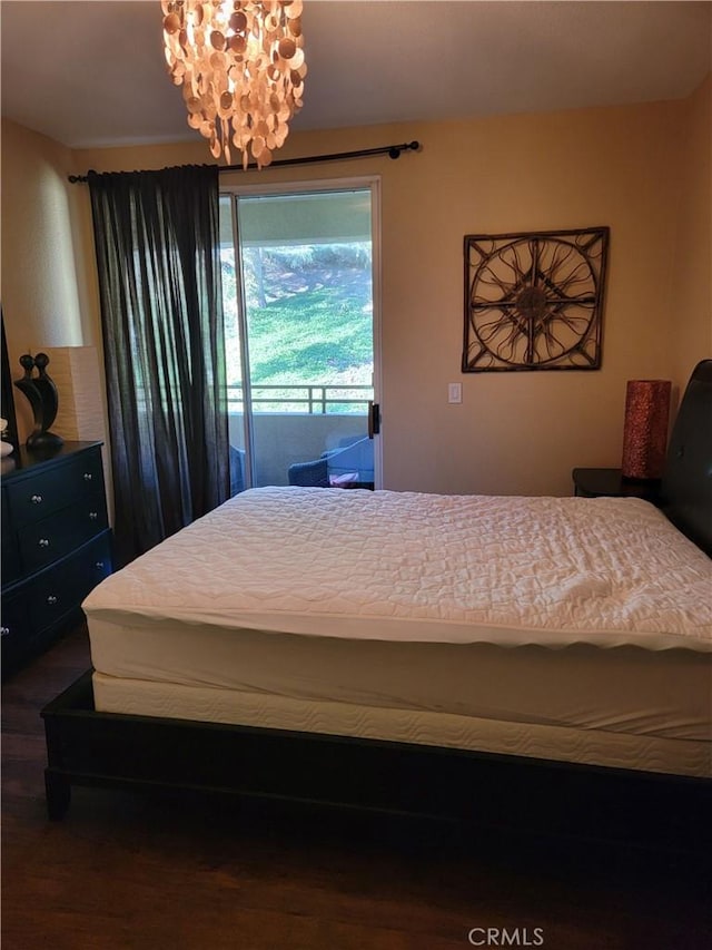 22681 Oakgrove Unit 536, Aliso Viejo, CA 92656 - bedroom featuring access to exterior, a chandelier, and wood finished floors