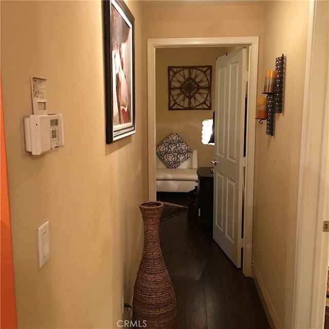 22681 Oakgrove Unit 536, Aliso Viejo, CA 92656 - hall with dark wood-type flooring and baseboards