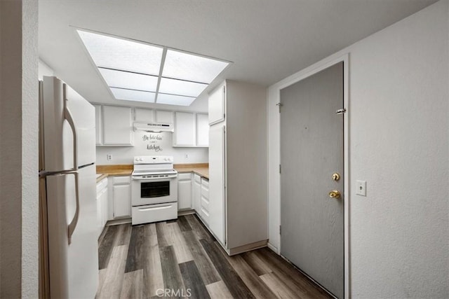 1213 W Cypress Ave Unit D, Lompoc, CA 93436 - kitchen with white appliances, dark wood-type flooring, light countertops, white cabinetry, and under cabinet range hood