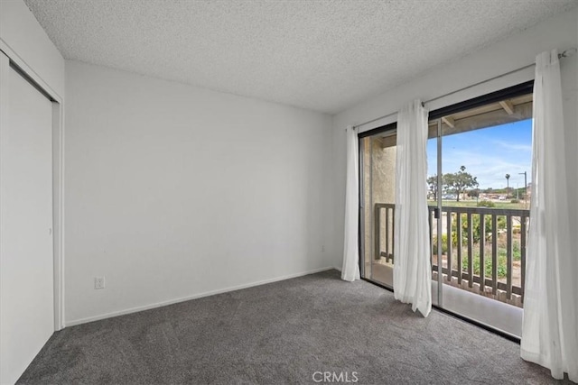 1213 W Cypress Ave Unit D, Lompoc, CA 93436 - unfurnished bedroom with access to exterior, carpet floors, and a textured ceiling