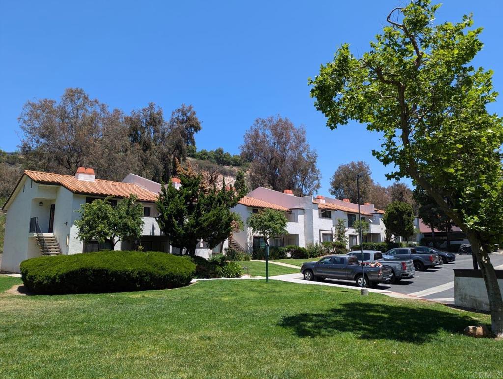 5055 Collwood Way Unit 43, San Diego, CA 92115 - view of grassy yard featuring stairs and a residential view