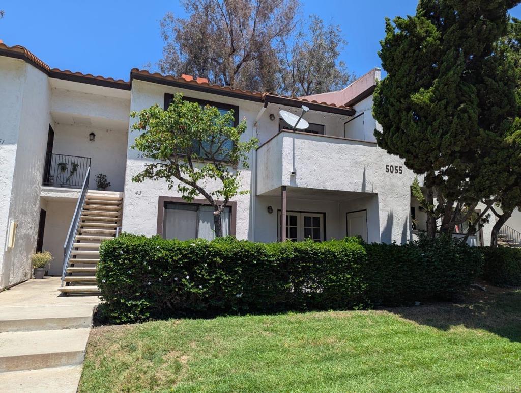 5055 Collwood Way Unit 43, San Diego, CA 92115 - mediterranean / spanish-style home with stairs, a front yard, a tile roof, and stucco siding