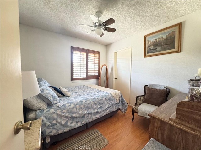7446 Bangor Ave, Hesperia, CA 92345 - bedroom with a textured ceiling, wood finished floors, and ceiling fan