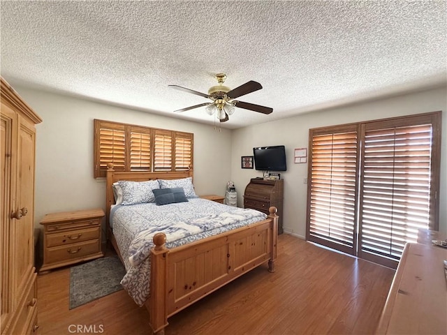 7446 Bangor Ave, Hesperia, CA 92345 - bedroom with wood finished floors, a textured ceiling, ceiling fan, and baseboards