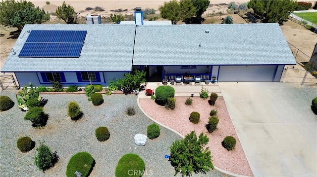 7446 Bangor Ave, Hesperia, CA 92345 - ranch-style house featuring roof mounted solar panels and driveway