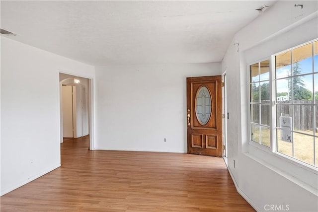 5219 Fleming Rd, Atwater, CA 95301 - empty room featuring light wood-type flooring, baseboards, and arched walkways