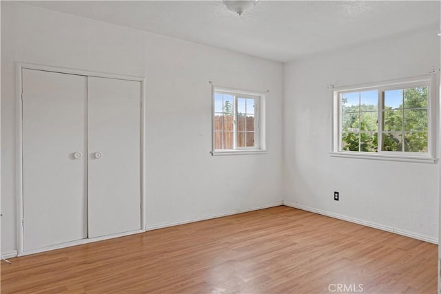 5219 Fleming Rd, Atwater, CA 95301 - unfurnished bedroom featuring light wood-style flooring, a closet, and baseboards