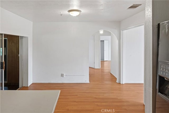 5219 Fleming Rd, Atwater, CA 95301 - interior space with arched walkways, light wood-type flooring, and baseboards