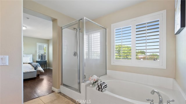 77 Crocus St, Redlands, CA 92373 - full bath with a shower stall, a bath, ensuite bathroom, and tile patterned floors