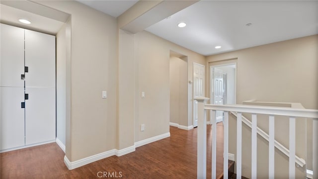 77 Crocus St, Redlands, CA 92373 - hall with wood finished floors, baseboards, recessed lighting, and an upstairs landing