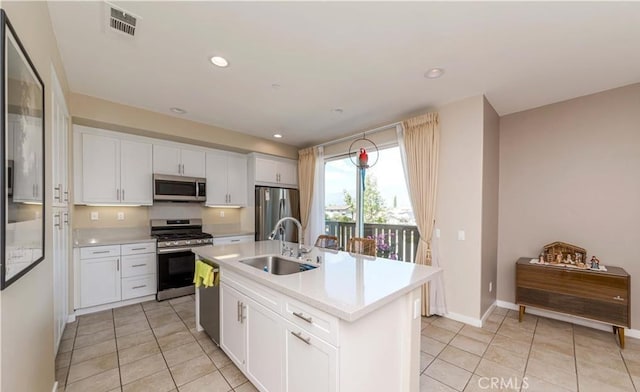 713 S Azusa Ave Unit A, Azusa, CA 91702 - kitchen with appliances with stainless steel finishes, light tile patterned floors, light countertops, white cabinets, and recessed lighting