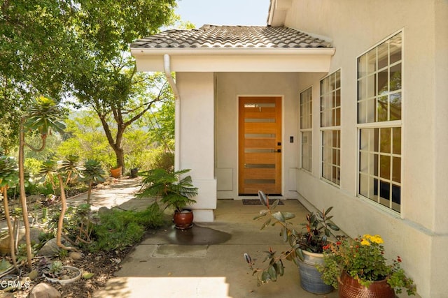 12841 Tree Ranch Rd, Ojai, CA 93023 - view of exterior entry with stucco siding and a tiled roof