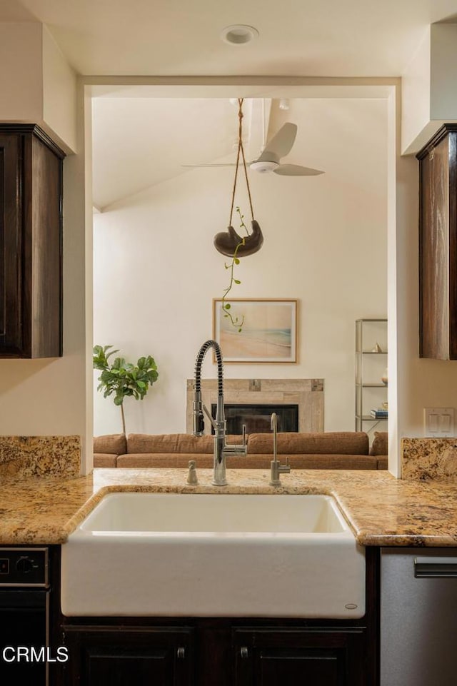 12841 Tree Ranch Rd, Ojai, CA 93023 - kitchen featuring a sink, dark brown cabinetry, light stone counters, and ceiling fan