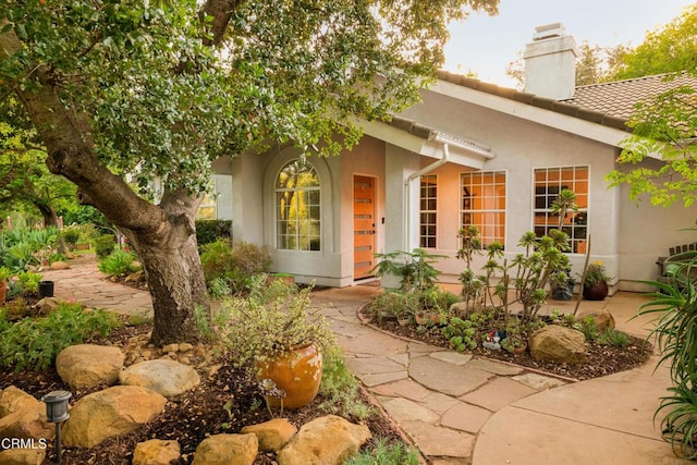 12841 Tree Ranch Rd, Ojai, CA 93023 - doorway to property with a chimney, stucco siding, and a tile roof