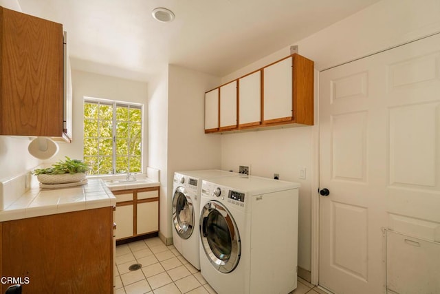 12841 Tree Ranch Rd, Ojai, CA 93023 - laundry area with separate washer and dryer, light tile patterned floors, and cabinet space
