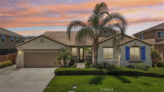 6125 Coopers Hawk Dr, Jurupa Valley, CA 91752 - mediterranean / spanish home with stucco siding, a tile roof, a garage, and driveway