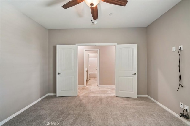 6125 Coopers Hawk Dr, Jurupa Valley, CA 91752 - unfurnished bedroom with light carpet, baseboards, and ceiling fan