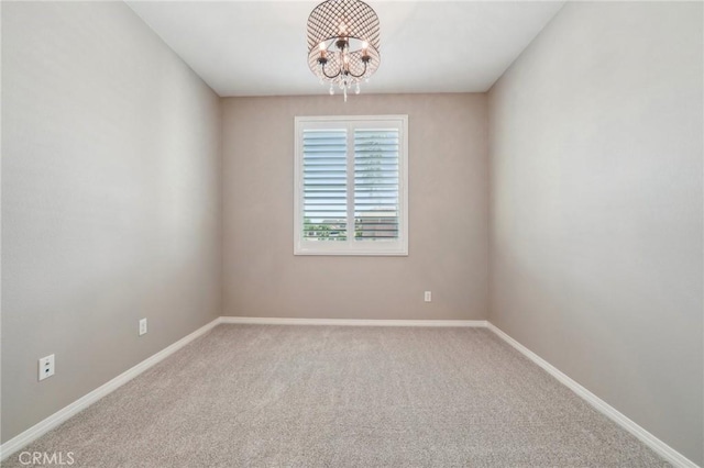 6125 Coopers Hawk Dr, Jurupa Valley, CA 91752 - empty room featuring a chandelier, carpet, and baseboards