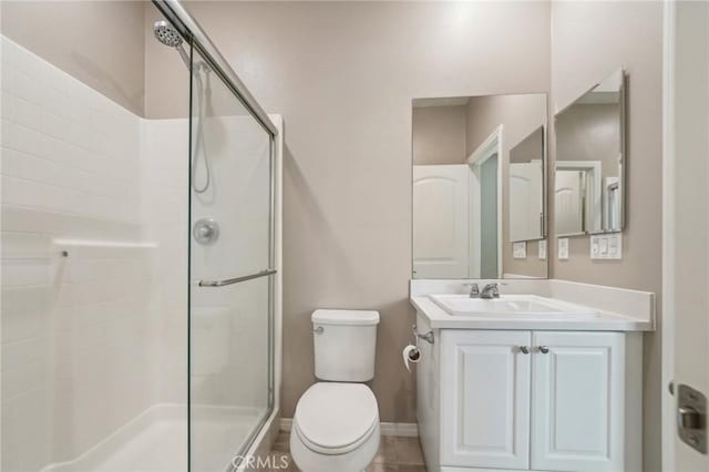 6125 Coopers Hawk Dr, Jurupa Valley, CA 91752 - bathroom featuring a stall shower, toilet, vanity, and baseboards