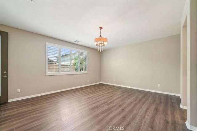 6125 Coopers Hawk Dr, Jurupa Valley, CA 91752 - unfurnished room with wood finished floors and baseboards