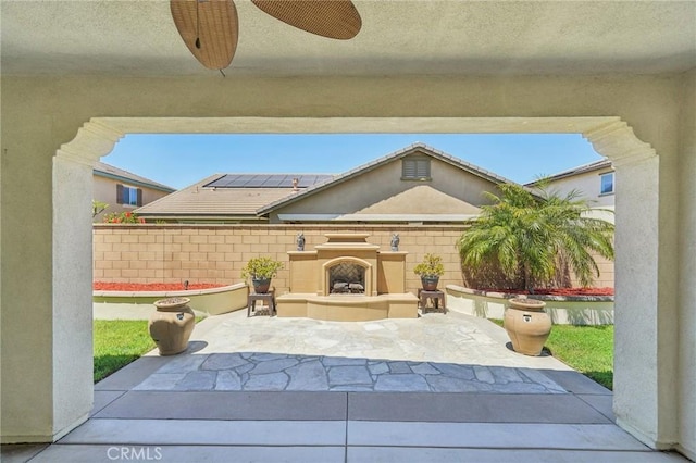6125 Coopers Hawk Dr, Jurupa Valley, CA 91752 - view of patio featuring a fireplace
