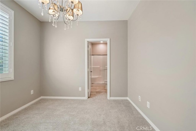 6125 Coopers Hawk Dr, Jurupa Valley, CA 91752 - carpeted spare room with a chandelier and baseboards
