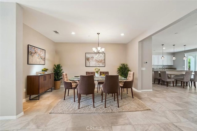 6125 Coopers Hawk Dr, Jurupa Valley, CA 91752 - dining area with baseboards, recessed lighting, and a chandelier