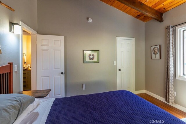31045 Valley Oak Dr, Running Springs, CA 92382 - bedroom with wood ceiling with exposed beams, wood finished floors, baseboards, and high vaulted ceiling