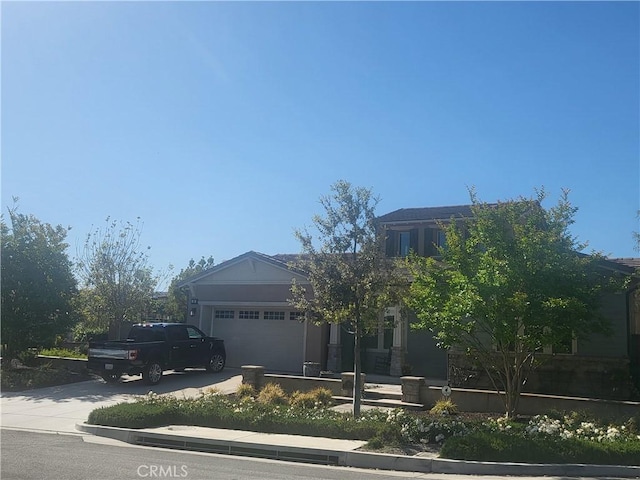 20 Galante St, Rancho Mission Viejo, CA 92694 - view of front facade featuring driveway and a garage