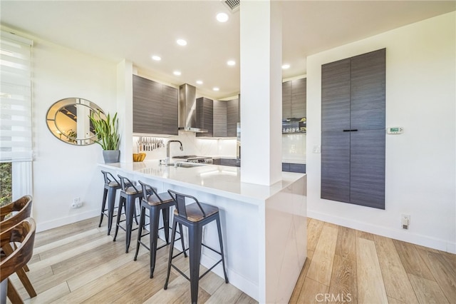 528 San Andres Dr, Solana Beach, CA 92075 - kitchen with a sink, a kitchen bar, modern cabinets, light wood-type flooring, and recessed lighting