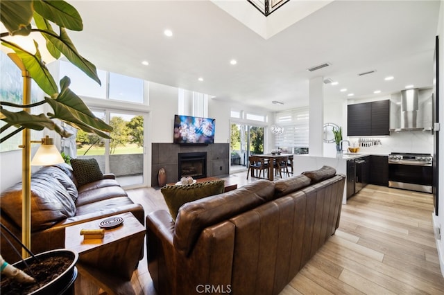 528 San Andres Dr, Solana Beach, CA 92075 - living room featuring a fireplace, light wood finished floors, and recessed lighting