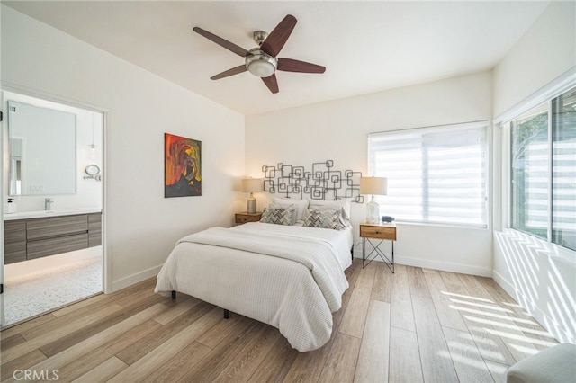 528 San Andres Dr, Solana Beach, CA 92075 - bedroom featuring wood finished floors, baseboards, connected bathroom, and a ceiling fan