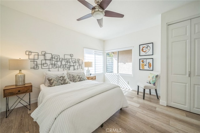 528 San Andres Dr, Solana Beach, CA 92075 - bedroom with baseboards, light wood finished floors, a ceiling fan, and a closet
